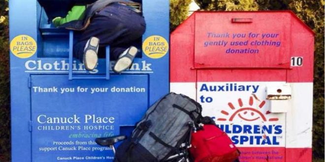Woman who died trapped in donation bin